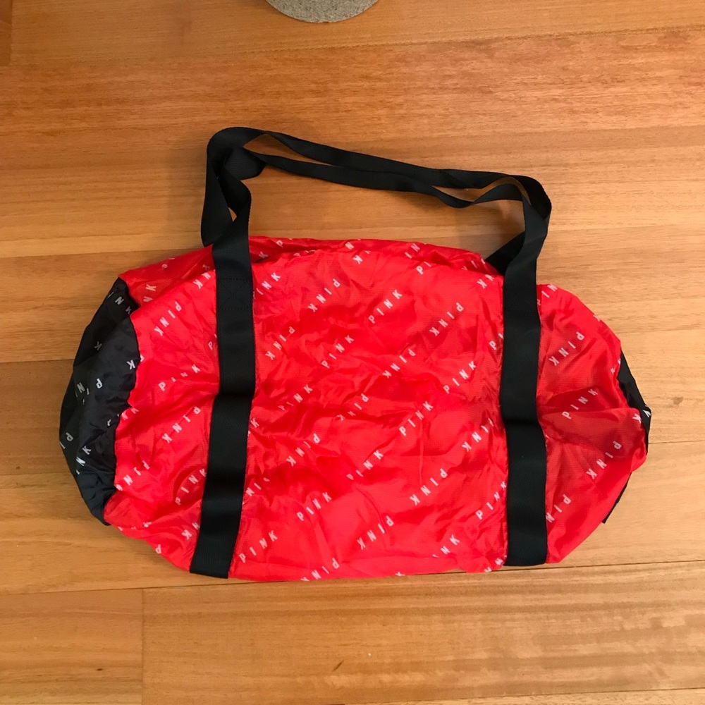 Red, black & white packable duffel bag